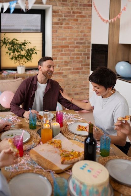 Free Photo high angle smiley couple at table