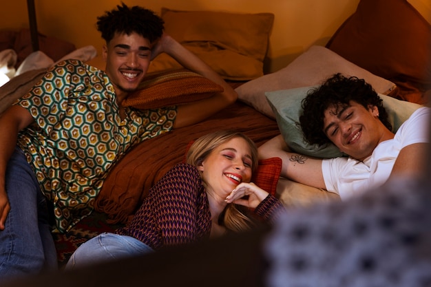 High angle smiley friends laying in bed