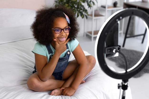 High angle smiley girl recording video