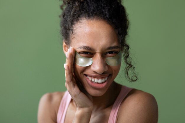 High angle smiley woman with eye patches