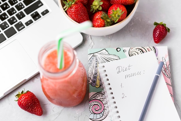 High angle smoothie and keyboard