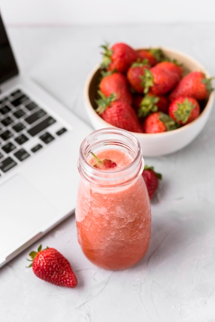 High angle smoothie and keyboard