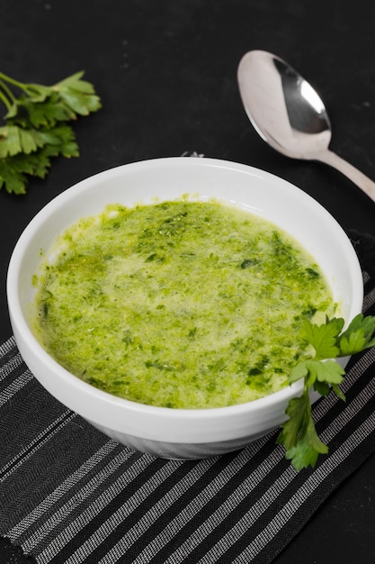 Free photo high angle of soup bowl with parsley