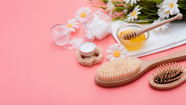 High angle of spa brushes and honey