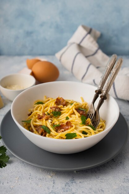 High angle spaghetti bowl with forks