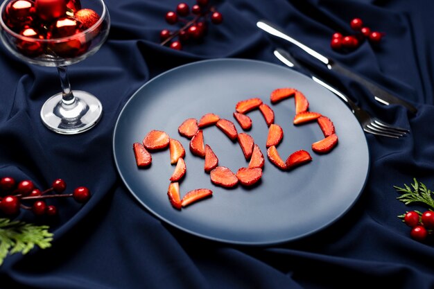 High angle strawberries on plate new year celebration