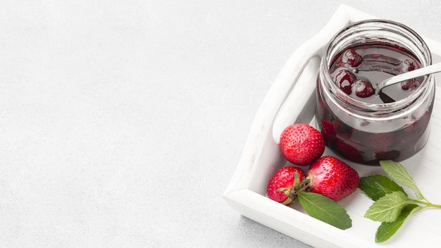 Free Photo high angle strawberry jam frame