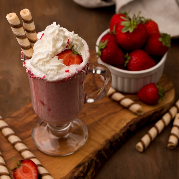 Free photo high angle of strawberry milkshake with cream