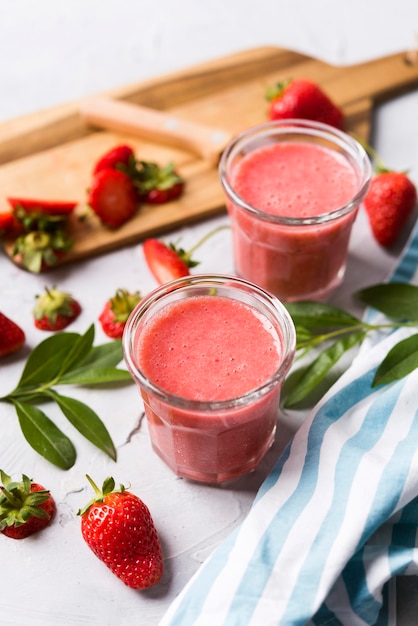 Free photo high angle strawberry smoothies in glass