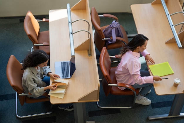 Free Photo high angle students studying together