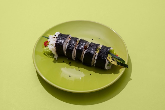 Free Photo high angle sushi on green plate