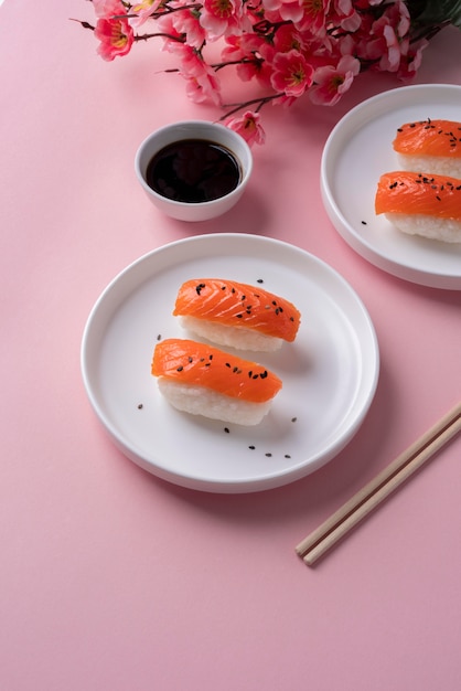 Free Photo high angle sushi with flowers arrangement