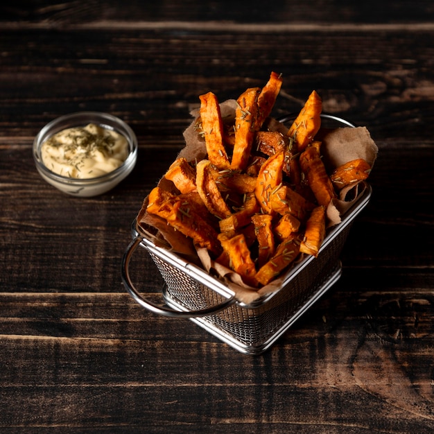 Free photo high angle sweet potato fries and sauce