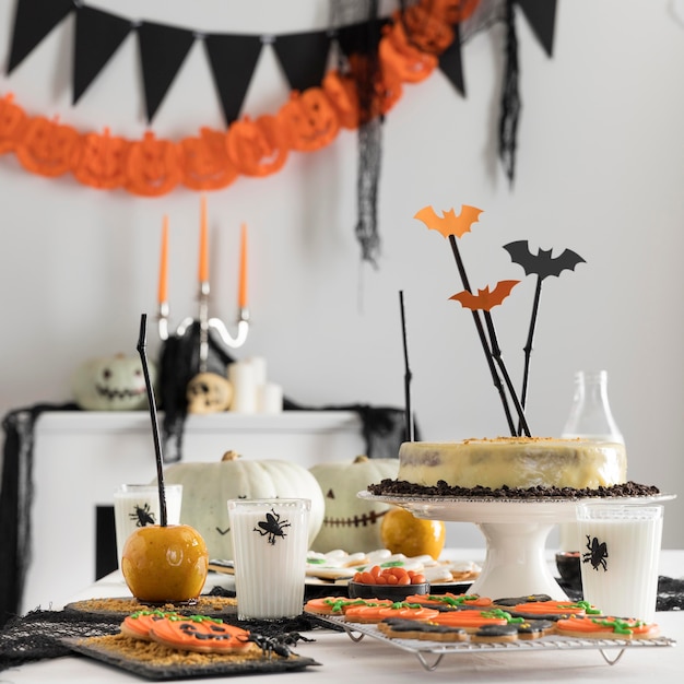 Free photo high angle table with halloween party treats and decorations