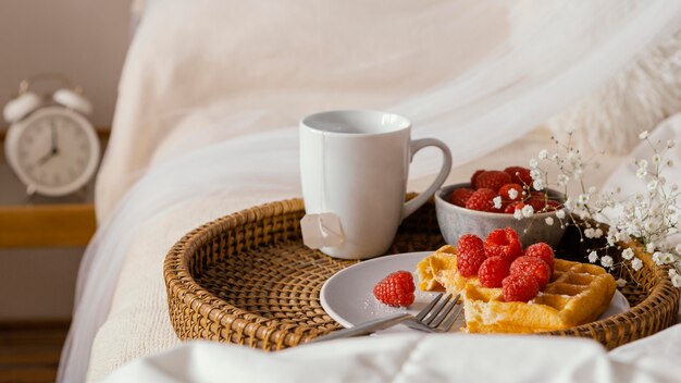 High angle tasty raspberry waffle on plate