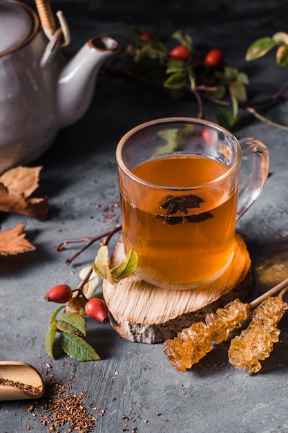 Free photo high angle tea in glass with crystallized sugar