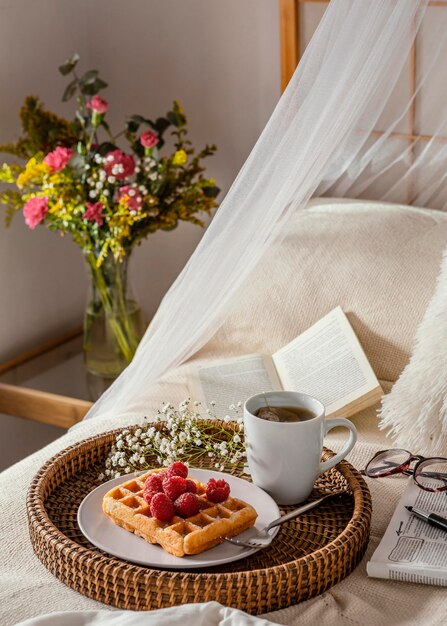 High angle tea and waffle on plate