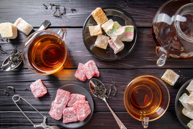 High angle tea with turkish delight on desk