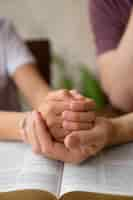 Free photo high angle teacher and kid praying together