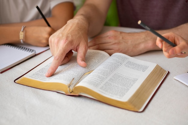 High angle teacher with bible at school