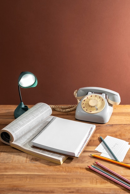 Free photo high angle telephone and books arrangement