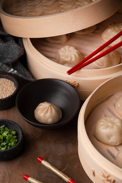 High angle of traditional asian dumplings with chopsticks