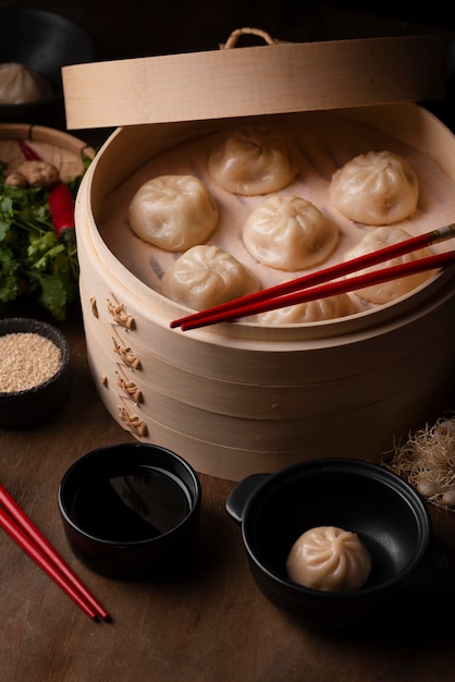 Free Photo high angle of traditional asian dumplings with chopsticks