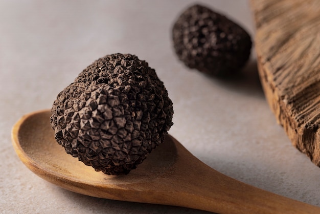 Free Photo high angle truffle on wooden spoon