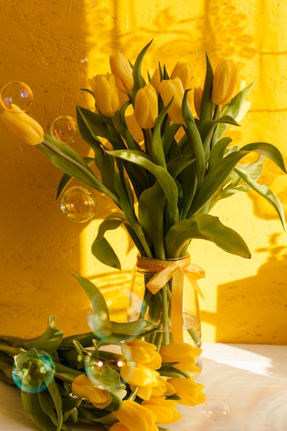 Free photo high angle vase with blooming flowers