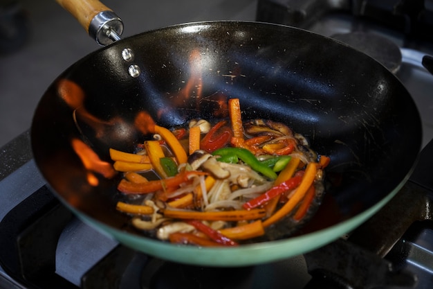 Free Photo high angle of vegetables getting sauteed in the pan