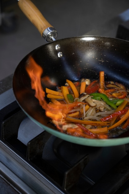 Free Photo high angle of vegetables getting sauteed in the pan