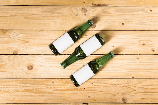 High angle view of alcoholic bottles on wooden surface