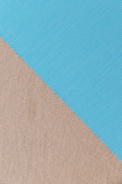 Free photo high angle view of blue fabric material on plain textile