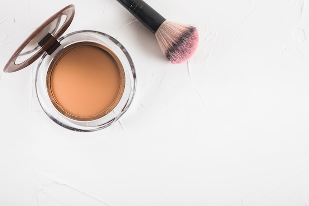 High angle view of blusher with brush on white background