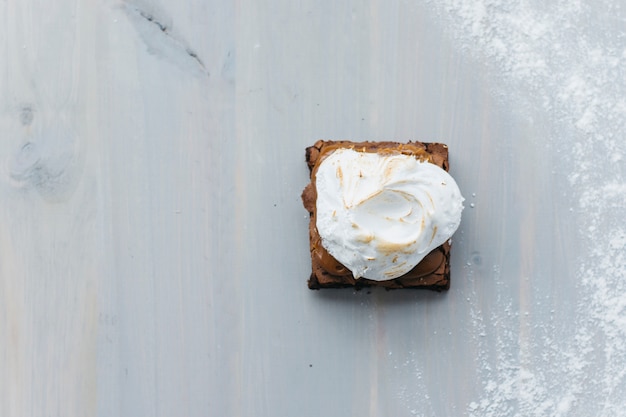 High angle view of delicious pastry with whipped cream