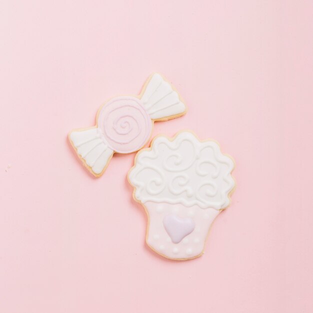 High angle view of dessert cookies on pink background