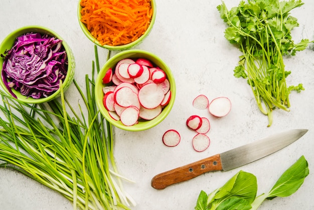 High angle view of fresh organic vegetables and knife