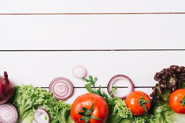 Free Photo high angle view of fresh vegetables on wooden background