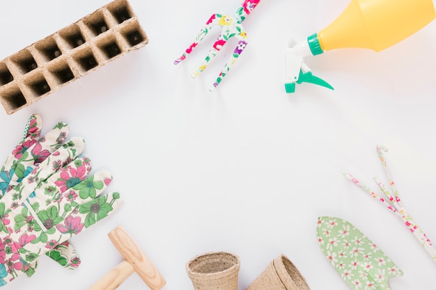 High angle view of gardening tools against white background