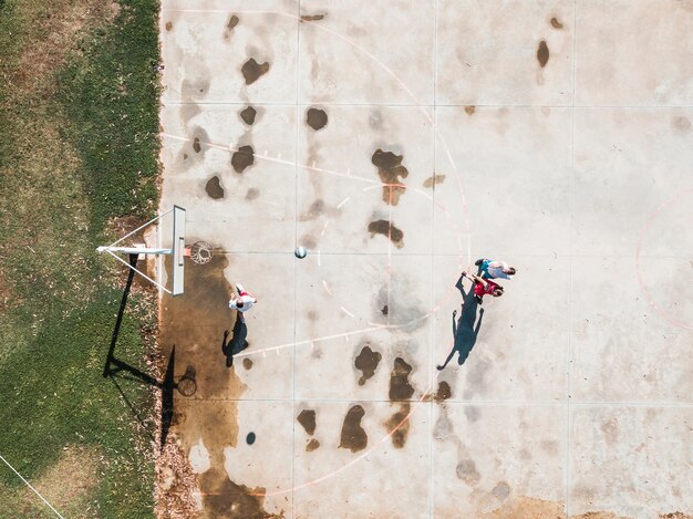 High angle view of player throwing basketball in the hoop