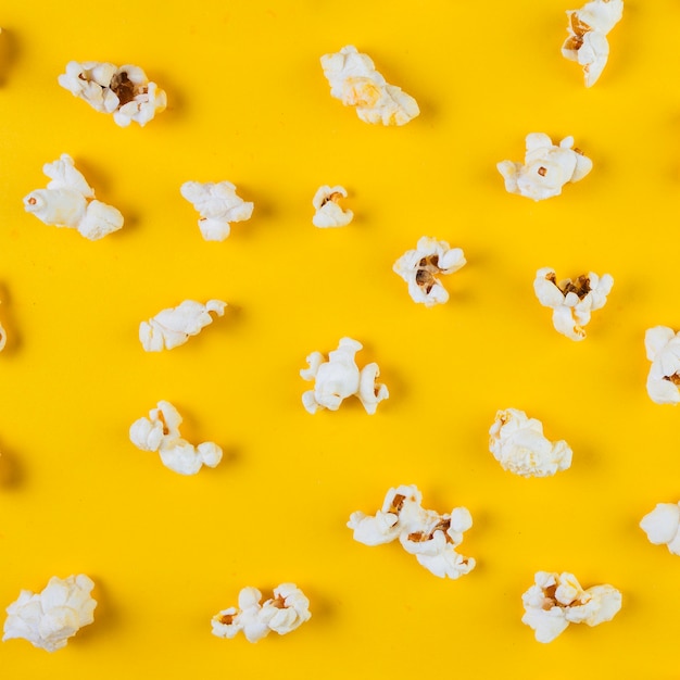 High angle view of popcorn on yellow background