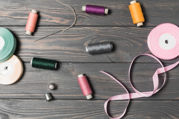 High angle view of sewing tool on wooden background