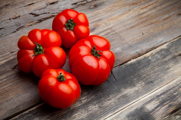 High angle view tomatoes on dark wooden background. horizontal