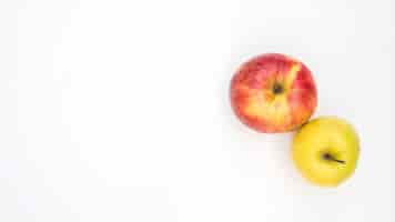 Free photo high angle view of two apples on white background