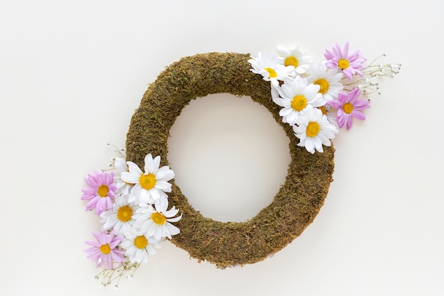 High angle view of wreath with beautiful pink and white daisy flowers