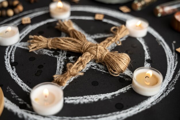 Free Photo high angle voodoo doll and candles