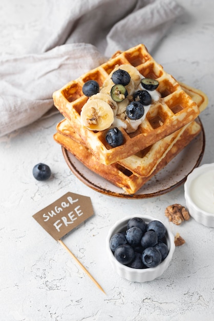 Free photo high angle waffles with fruits arrangement