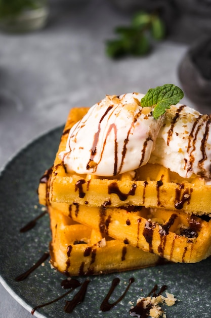 High angle waffles with ice cream on plate