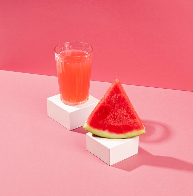 High angle watermelon juice and slice