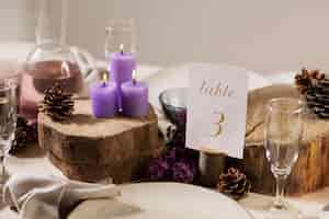 Free photo high angle wedding table with pine cones